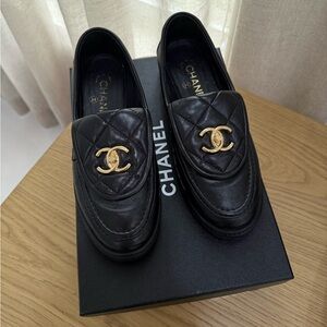 CHANEL Black Quilted Leather Slip-On Loafers with Gold CC Emblem